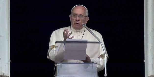 Pope Francis delivers a speech from the window of his apartment during his Sunday Angelus prayer in St. Peter's Square at the Vatican on July 27, 2014. AFP PHOTO / ANDREAS SOLARO (Photo credit should read ANDREAS SOLARO/AFP/Getty Images)