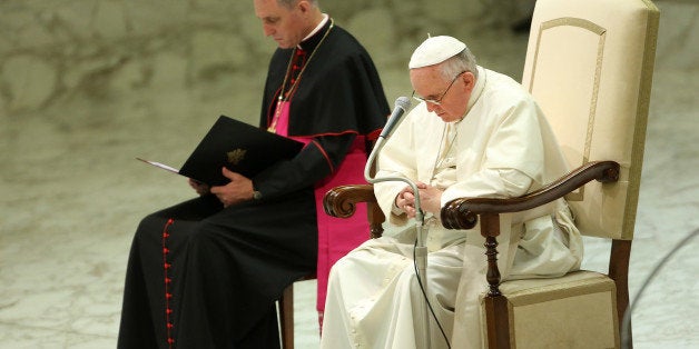 VATICAN CITY, VATICAN - AUGUST 06: Pope Francis chairs his weekly audience at the Paul VI Hall on August 6, 2014 in Vatican City, Vatican. In the first General Audience since his summer break, Pope Francis resumed his Catechesis on the Church and the People of God, but his mind was also on the tensions and recent conflict in the Middle East and the earthquake in China last Sunday which left hundreds dead and over two thousand injured. (Photo by Franco Origlia/Getty Images)