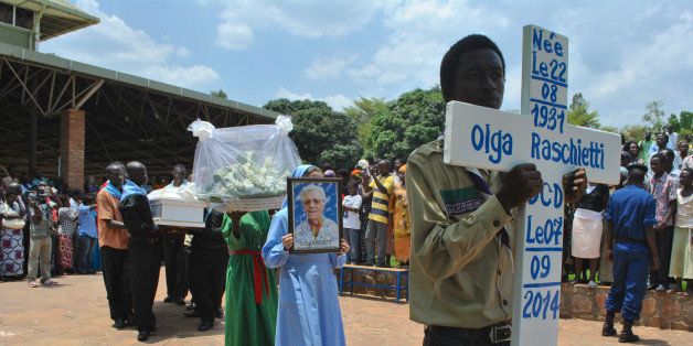 BUJUMBURA, BURUNDI - SEPTEMBER 10: Hundreds of people attend the funeral ceremony of 3 Italian nuns, found dead on September 7 inside a parish in a southern suburb of capital Bujumbura, at Sanctuaire Mont Sion Gikungu in Bujumbura, Burundi on September 10, 2014. (Photo by Ndabashinze Renovat/Anadolu Agency/Getty Images)