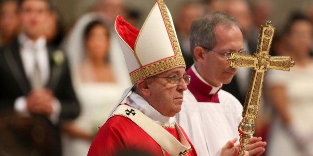 VATICAN CITY, VATICAN - SEPTEMBER 14: Pope Francis attends the Sunday Mass at the St. Peter's Basilica on September 14, 2014 in Vatican City, Vatican. During the Mass Pontiff celebrated the marriage of twenty couples. (Photo by Giulio Origlia/Getty Images)