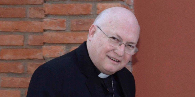 In this July 25, 2014 photo, Bishop Rogelio Ricardo Livieres Plano walks to church in Ciudad del Este, Paraguay. Livieres Plano, a member of the conservative Opus Dei movement, has been removed by Pope Francis from a Paraguayan diocese said the Vatican Thursday, Sept. 25, 2014, after he clashed with his fellow bishops by opening his own seminary and promoting an Argentine priest accused of inappropriate sexual behavior. (AP Photo/ABC, Raul Gonzalez)