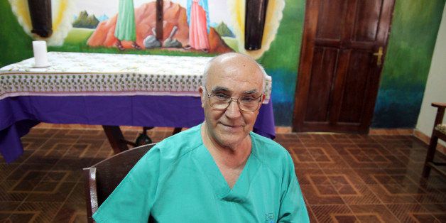 In this photo taken in 2013, provided by the San Juan de Dios Order, Spanish priest Manuel Garcia Viejo, poses in the San Juan de Dios Hospital in the city of Lunsar in Sierra Leone where he worked. Garcia Viejo, who was diagnosed with the Ebola virus while working in Sierra Leone, was flown back to Spain for treatment in a Madrid hospital Monday, Sept. 22, 2014. Brother Manuel Garcia Viejo, was a medical director of the San Juan de Dios Hospital in the city of Lunsar in Sierra Leone. (AP Photo/San Juan de Dios Order)