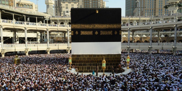 MECCA, SAUDI ARABIA - SEPTEMBER 30: Muslim pilgrims from all around the world circle counterclockwise Islam's holiest shrine, the Kaaba, ahead of upcoming Eid Al-Adha (Feast of Sacrifice) at Masjid al-Haram (the Grand Mosque) in the Muslim holy city of Mecca, Saudi Arabia on September 30, 2014. (Photo by Dilek Mermer/ Anadolu Agency/Getty Images)