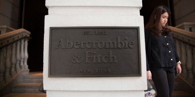 A woman exits an Abercrombie & Fitch Co. store in the Central district of Hong Kong, China, on Wednesday, April 16, 2014. Hong Kong is scheduled to release consumer price index (CPI) figures on April 22. Photographer: Brent Lewin/Bloomberg via Getty Images