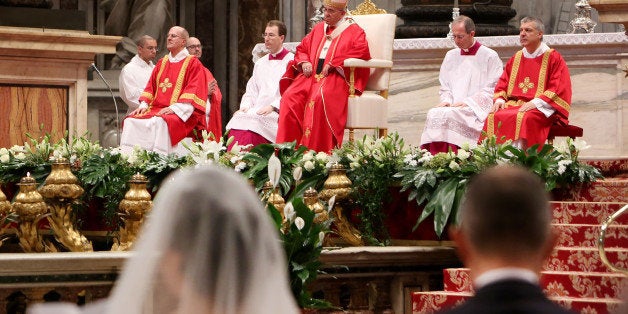 VATICAN CITY, VATICAN - SEPTEMBER 14: Pope Francis attends the Sunday Mass at the St. Peter's Basilica on September 14, 2014 in Vatican City, Vatican. During the Mass Pontiff celebrated the marriage of twenty couples. (Photo by Giulio Origlia/Getty Images)