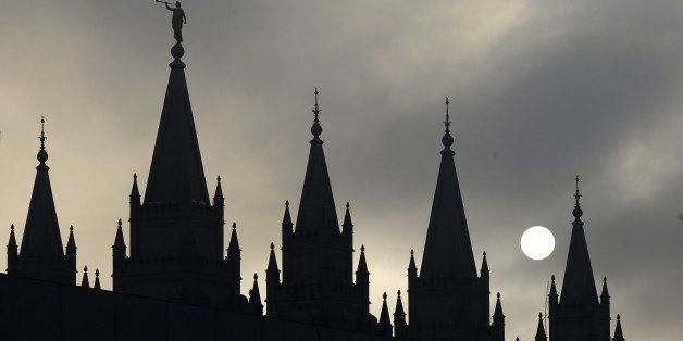 FILE - In this Feb. 6, 2013, file photo, the angel Moroni statue, silhouetted against a cloud-covered sky, sits atop the Salt Lake Temple, in Temple Square, in Salt Lake City. While Kate Kellyâs former church leaders meet in Virginia on Sunday, June 22, 2014, to decide if sheâll be ousted from her religion, the founder of a prominent Mormon women's group will hold a vigil in Salt Lake City along with hundreds of her supporters. (AP Photo/Rick Bowmer, File)
