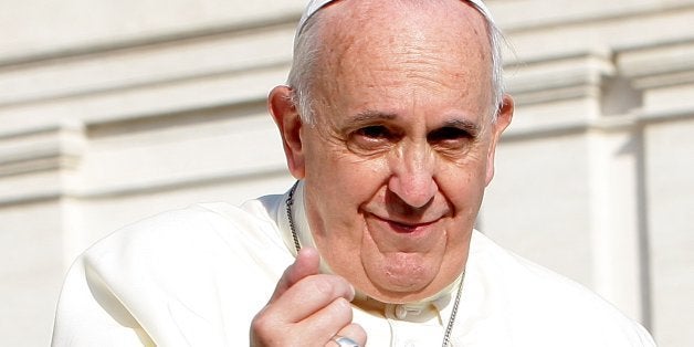 VATICAN CITY, VATICAN - OCTOBER 08: Pope Francis waves to the faithful as he arrives in St. Peter's square for his weekly public audience on October 8, 2014 in Vatican City, Vatican. Speaking to the crowds gathered in St. Peter's Square for the weekly General Audience Pope Francis appealed for Christian unity, pointing out that divisions between Christians of different denominations are hurtful for the Church and for Christ. (Photo by Franco Origlia/Getty Images)