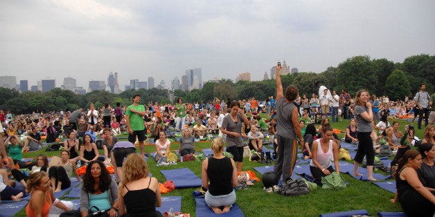 NEW YORK - JUNE 22: Atmosphere at the in a mass yoga class on the Great Lawn in Central Park on June 22, 2010 in New York Ci