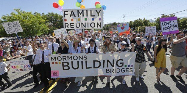 FILE - In this June 2, 2013 file photo, members of the Mormons Building Bridges march during the Utah Gay Pride Parade in Salt Lake City. A three-day conference opens Friday, Sept. 13, 2013 to explore how the Mormon faith is dealing with gays and lesbians. (AP Photo/Rick Bowmer, File)