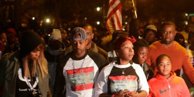 Lesley McSpadden, center, mother of Michael Brown, marches in a protest in Ferguson, Mo. on Saturday, Oct. 11, 2014. On Aug. 9, 2014, a white police officer fatally shot Brown, an unarmed black 18-year old, in the St. Louis suburb. (AP Photo/Charles Rex Arbogast)