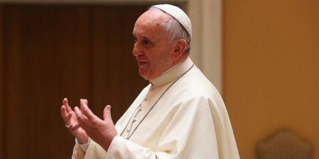 VATICAN CITY, VATICAN - OCTOBER 22: Pope Francis talks to the team of FC Bayern Muenchen during an private audience in the Palace of the Vatican on October 22, 2014 in Vatican City, Vatican. (Photo by Alexander Hassenstein/Bongarts/Getty Images)