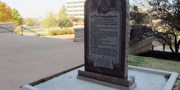 A Ten Commandments monument erected outside the Oklahoma state Capitol is shown on Friday, Nov. 16, 2012. After the 6-foot-tall monument was put in place, the Oklahoma lawmaker who paid for it acknowledged the misspelling of the words Sabbath as "Sabbeth" and maidservant as "maidseruant." (AP Photo/Sean Murphy)