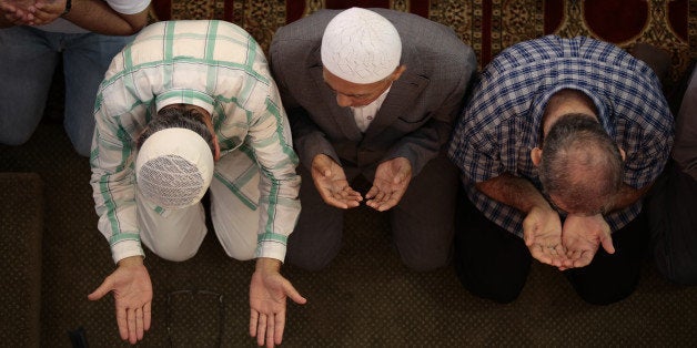 NEW YORK, NY - JULY 28: Muslims living in New York City perform Eid al-Fitr prayer at Eyup Sultan Mosque on July 28,2014. Eid al-Fitr also known Feast of Breaking the Fast, is religious holiday celebrated by Muslims worldwide that marks the end of Ramadan, the Islamic holy month of fasting. (Photo by Bilgin Sasmaz/Anadolu Agency/Getty Images)