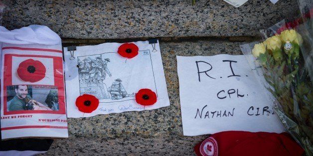Grieving Canadians mourn the loss of fallen heroes Nathan Cirillo and Patrice Vincent at the National War Memorial in Ottawa. Flowers, stuffed animals, poems and personal items are left at the base of the Cenotaph monument. Soldiers representing their regiments, and their brothers and sisters in arms continue to guard the Tomb of the Unknown Soldier amid heightened security.#TrueNorthStrong