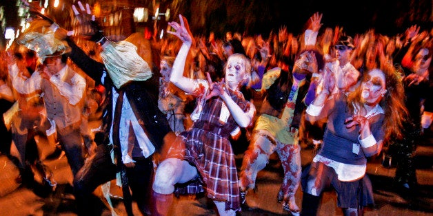 Participants of Greenwich Village's Halloween parade re-enact the zombie strut from Michael Jackson's "Thriller" video, Friday, Oct. 31, 2008 in New York. (AP Photo/Dima Gavrysh)