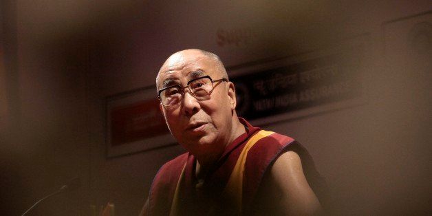 Tibetan spiritual leader, Dalai Lama, speaks during an event organized by Indian Merchants' Chamber in Mumbai, India, Thursday, Sept. 18, 2014. Tibetan exiles held several protests in the Indian capital city of New Delhi against the visit of Chinese President Xi Jinping, on Thursday. (AP Photo/Rajanish Kakade)