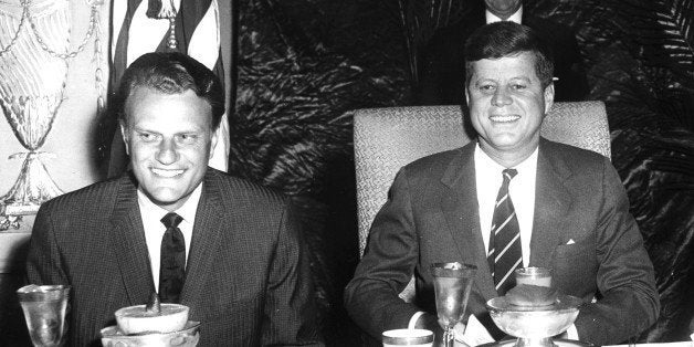 US President John F. Kennedy (1917 - 1963) (right) sits with Christian evangelist Billy Graham at the National Prayer Breakfast, Washington DC, February 9, 1994. (Photo by Abbie Rowe/PhotoQuest/Getty Images)