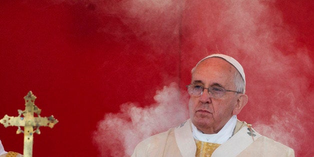 Incense smoke rises in front of Pope Francis as he celebrates a mass at Rome's Verano cemetery, on the occasion of All Saint
