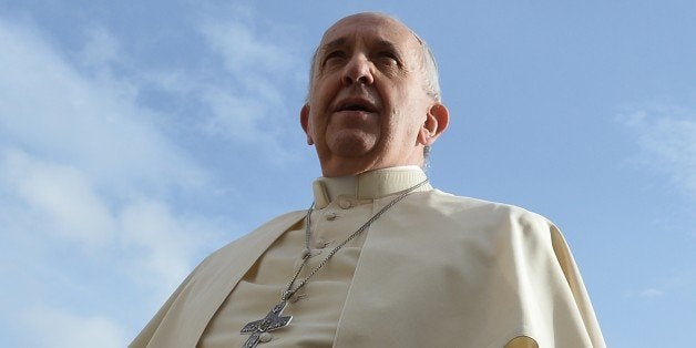 Pope Francis arrives for his general audience at St Peter's square on November 5, 2014 at the Vatican. AFP PHOTO / ALBERTO PIZZOLI (Photo credit should read ALBERTO PIZZOLI/AFP/Getty Images)