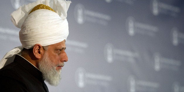 Devotees follow a speech by Mirza Masroor Ahmad, the head of the Ahmadiyya Muslim Jamaat Community at a Mosque in Hamburg, northern Germany on December 5, 2012. AFP PHOTO / AXEL HEIMKEN GERMANY OUT (Photo credit should read Axel Heimken/AFP/Getty Images)