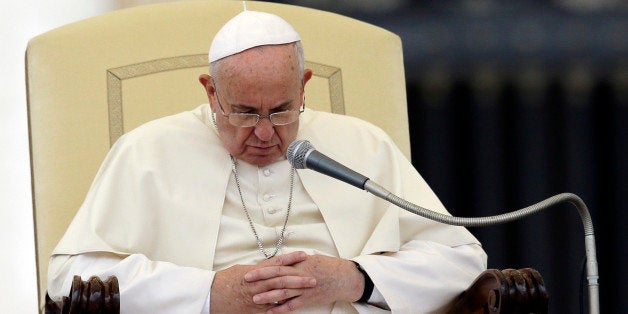 Pope Francis pauses during the weekly general audience in St. Peter's Square, at the Vatican, Wednesday, Nov. 12, 2014. (AP Photo/Gregorio Borgia)