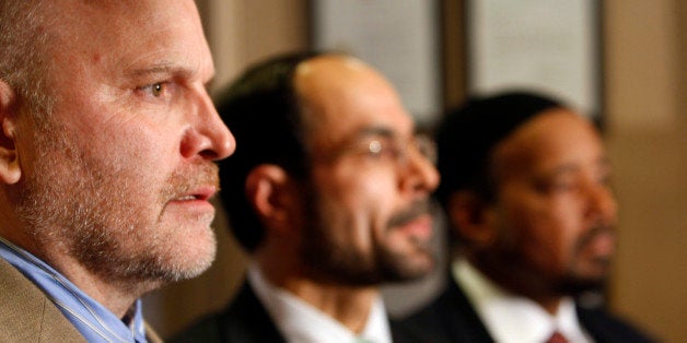 Ibrahim Hooper, left, spokesman for the Council on American-Islamic Relations, speaks at a news conference regarding the arrest in Pakistan of five missing young men in Washington, Wednesday, Dec. 9, 2009. Behind him are CAIR national executive director Nihad Awad, center, and and Imam Mahdi Bray, executive director of the Muslim American Society Freedom, right. (AP Photo/Gerald Herbert)