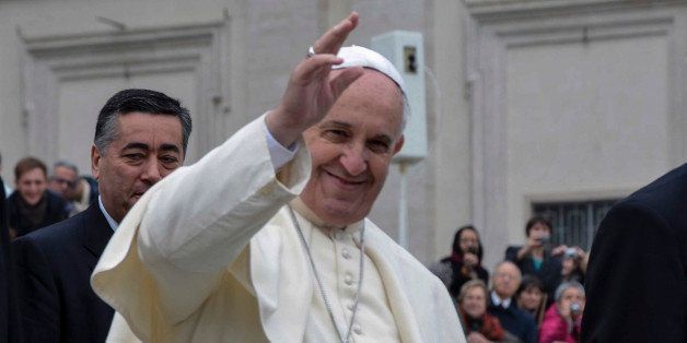 VATICAN CITY, VATICAN - NOVEMBER 26: Pope Francis greets the crowd at the end of his general audience at St Peter's square on November 26, 2014 at the Vatican.