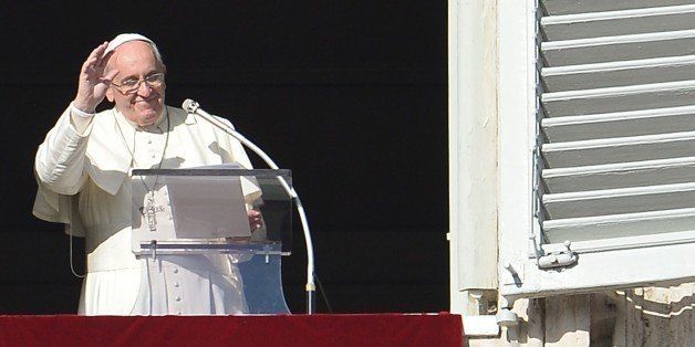 Pope Francis addresses the crowd from his private apartments during his sunday's Angelus prayer at St Peter's square on December 7, 2014 at the Vatican. AFP PHOTO / ALBERTO PIZZOLI (Photo credit should read ALBERTO PIZZOLI/AFP/Getty Images)