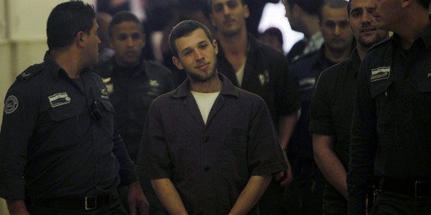 JERUSALEM, ISRAEL - DECEMBER 15: Israeli prison guards escort Yitzhak Gabai, Nahman Twito and Shlomo Twito at Jerusalem District Court December 15, 2014. The three suspects, members of the right-wing Lehava organisation, are charged with an arson attack last month targeting a Jewish-Arab school in Jerusalem. (Photo by Muammar Awad/Anadolu Agency7Getty Images)