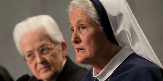 Sister Sharon Holland, left, and Mother Agnes Mary Donovan attend a press conference at the Vatican, Tuesday, Dec. 16, 2014. The Vatican released the long-awaited results of its controversial three-year investigation into U.S. women's religious orders on Tuesday, and thanked American religious sisters, for their selfless work caring for the poor, gently suggesting ways to survive amid a decline in numbers and promising to value their "feminine genius" more. After years of tension and distrust between the nuns and the Vatican, there was no criticism of American nuns, no demands that they shift their focus from social justice issues to emphasize Catholic teaching on abortion, no condemnation that a feminist, secular mentality had taken hold in their ranks. (AP Photo/Andrew Medichini)