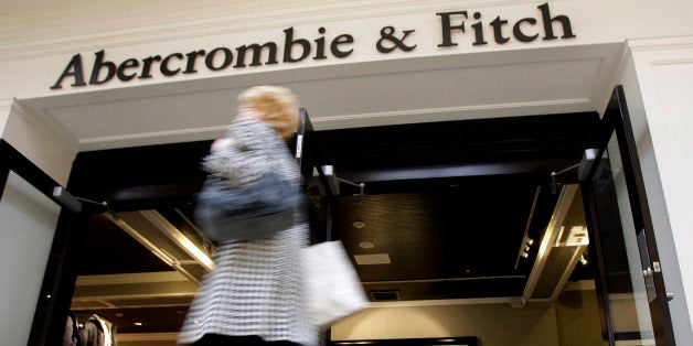 FILE - In this Thursday, Dec. 4, 2008, file photo, a shopper hurries past the Abercrombie & Fitch store at Beachwood Place Mall in Beachwood, Ohio. Drops in sales and weak profit forecasts are quite a change for the retailers that gained popularity in the last decade among teens that coveted their logo tees and trendy jeans that became a high school uniform of sorts. But these stores have been losing favor with their core demographic since the recession. (AP Photo/Amy Sancetta, File)