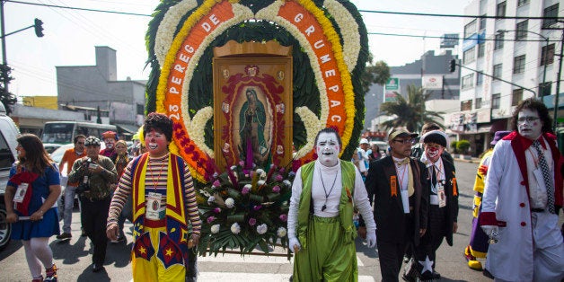 MEXICO CITY, MEXICO - DECEMBER 16: Clowns march to the Basilica of Guadalupe on December 16, 2014 in Mexico City, Mexico. The 26th Pilgrimage of the Clowns of Mexico is an annual tradition. Clowns march from the Glorieta de Peralvillo to the Basilica of Guadalupe. (Photo by Miguel Tovar/LatinContent/Getty Images)