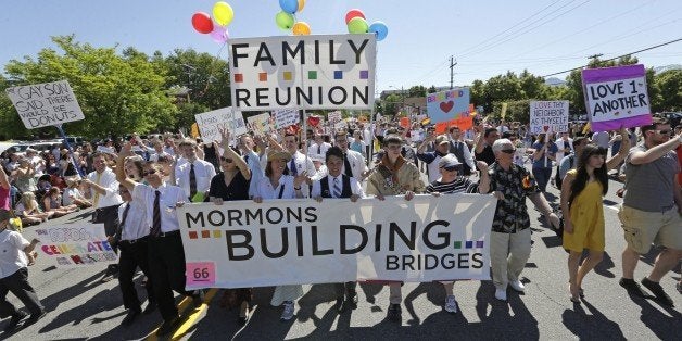 FILE - In this June 2, 2013 file photo, members of the Mormons Building Bridges march during the Utah Gay Pride Parade in Salt Lake City. The Salt Lake City Council is decrying the rejection of a Mormon LGBT group's proposed float in Utah's most popular parade, but it won't pull out of the event. (AP Photo/Rick Bowmer, File)