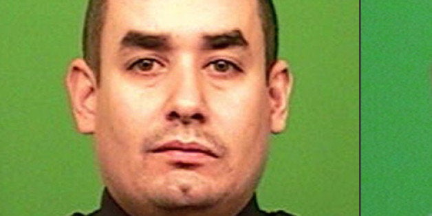 FILE - This combination made from photos provided by the New York Police Department shows officers Rafael Ramos, left, and We