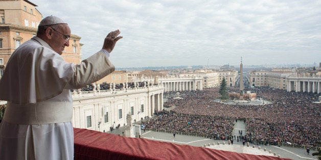 In this picture provided by the Vatican newspaper L'Osservatore Romano, Pope Francis delivers his "Urbi et Orbi" (to the city and to the world) blessing from the central balcony of St. Peter's Basilica at the Vatican, Thursday, Dec. 25, 2014. Tens of thousands of Romans and tourists in St. Peter's Square listened as the pontiff delivered the Catholic church's traditional "Urbi et Orbi" (Latin for "to the city and to the world) Christmas message from the central balcony of St. Peter's Basilica. Francis said: "truly there are so many tears this Christmas." Pope Francis focused his concern Thursday on those weeping in the world this Christmas, singling out refugees, hostages and others suffering in the Middle East, Africa and Ukraine as he prayed for hope and peace. (AP Photo/L'Osservatore Romano)