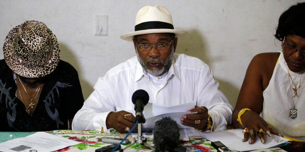Afro-Cuban Santeria priest Lazaro Cuesta reads predictions for 2015 in Havana, Cuba, Saturday, Jan. 3, 2015. Cuesta, one of t