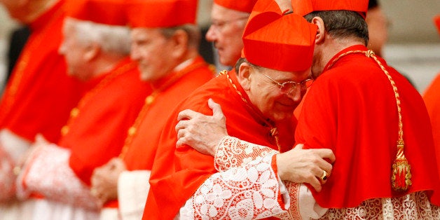 Newly-appointed US Cardinal Raymond Leo Burke, left, hugs Cardinal Giovanni Lajolo during a consistory inside St. Peter's Basilica, at the Vatican, Saturday, Nov. 20, 2010. Pope Benedict XVI formally created 24 new cardinals on Saturday amid cheers in St. Peter's Basilica, bringing a mostly Italian group into the elite club that will eventually elect his successor. (AP Photo/Pier Paolo Cito)