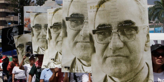 People march carrying portraits of slain Archbishop Oscar Arnulfo Romero on the 31st anniversary of his death in San Salvador, El Salvador, Thursday March 24, 2011. Thirty-one years ago on March 24, Romero was fatally shot on orders by an official in El Salvador's U.S.-backed army as he celebrated mass. Romero's fight for the poor during El Salvador's bloody civil war made him a national hero and an international human rights figure. (AP Photo/Luis Romero)