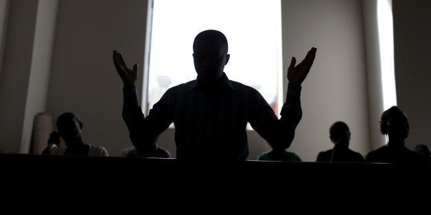 PORT-AU-PRINCE, HAITI - JANUARY 11: People pray in the new church built next to the National Cathedral that was destroyed five years ago by a magnitude 7.0 earthquake that struck just before 5 p.m. on Jan. 12, 2010, destroying buildings and killing as many as 316,000 people on January 11, 2015 in Port-au-Prince, Haiti. Five years later a church has been built next to the ruins and the city of Port-au-Prince struggles to recover even as the government is now locked in a stalemate over parliamentary elections that have been delayed for over three years, with almost daily protests occurring the people are asking for the elections to take place. (Photo by Joe Raedle/Getty Images)