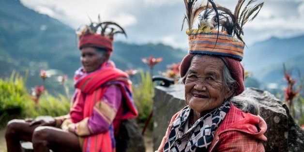Ifugao tribe ladies in front of rice terraces in Banaue, Ifugao region, Luzon, Philippines
