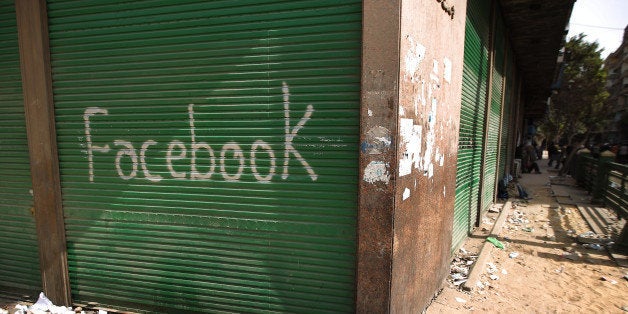 CAIRO, EGYPT - FEBRUARY 04: A shop in Tahrir Square is spray painted with the word Facebook after the government shut off internet access on February 4, 2011 in Cairo, Egypt. Anti-government protesters have called today 'The day of departure'. Thousands have again gathered in Tahrir Square calling for Egyptian President Hosni Mubarak to step down. (Photo by Peter Macdiarmid/Getty Images)