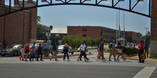 WELLSTON, MO - AUGUST 21:Students leave Normandy High School at the end of the school day as the drama of the killing of 18-year-old Michael Brown by white police officer Darren Wilson on August 9 in Ferguson, MO, plays itself out on Thursday, August 21, 2014, in Wellston, MO. Normandy is a statistically troubled high school that graduated Michael Brown. The school has the difficult task of raising young black males in an area notorious for racial profiling and unequal treatment at the hands of law enforcement.(Photo by Jahi Chikwendiu/The Washington Post via Getty Images)