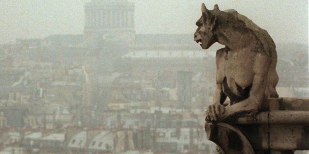 A gargoyle watches over Paris from the top of the 11th century Notre Dame cathedral Friday Jan 10, 1997. Notre Dame and its gargoyles are one of the typical features of medieval Paris pictured in Walt Disney's " Hunchback of Notre Dame", France's second-most popular film behind 1996's other mega hit, "Independence Day". In Background is the Pantheon dome.(AP Photo/Remy de la Mauviniere)