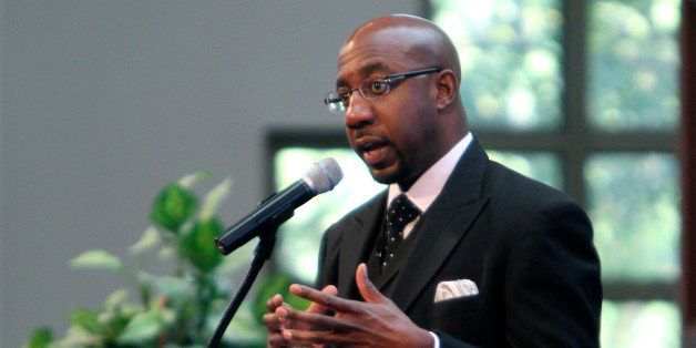 Rev. Raphael Warnock encourages parishioners to go out and vote in Tuesday's midterm elections during a service at the Ebenezer Baptist Church Sunday, Oct. 31, 2010, in Atlanta. (AP Photo/David Goldman)