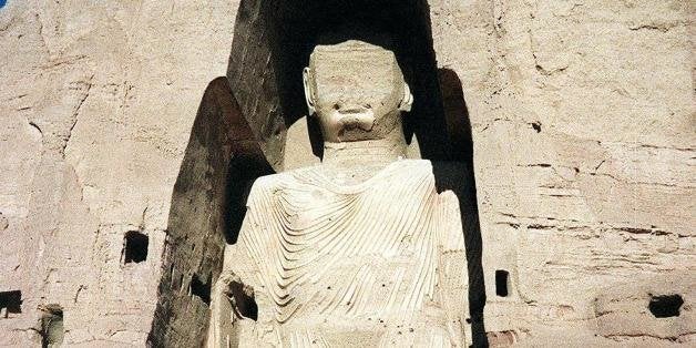 (FILES) An undated file photo shows an Afghan military truck parked under the shadow of a huge Buddha statue in the central province of Bamiyan in Afghanistan. Afghanistan's ruling Taliban militia began destroying 01 March 2001 all statues in the country, including the world's tallest standing Buddha in central Bamiyan province. Afghanistan is home to an array of pre-Islamic historic treasures from its days as a key stop on the ancient Silk Road and a strategic battleground for conquerers dating back to Alexander the Great. (FILM) AFP PHOTO/Jean CLAUDE-CHAPON (Photo credit should read JEAN CLAUDE-CHAPON/AFP/Getty Images)