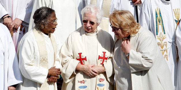 LONDON, ENGLAND - MAY 03: A group of women priests stand among hundreds on the steps of St Paul's Cathedral before going inside for a special service with Justin Welby, the Archbishop of Canterbury, to celebrate twenty years since the ordination of women priests on May 3, 2014 in London, England. More than 600 women priests attended the service which comes ahead of a vote in July when the Church of England is expected to pass legislation that will allow the women in the church to be ordained as Bishops. (Photo by Mary Turner/Getty Images)