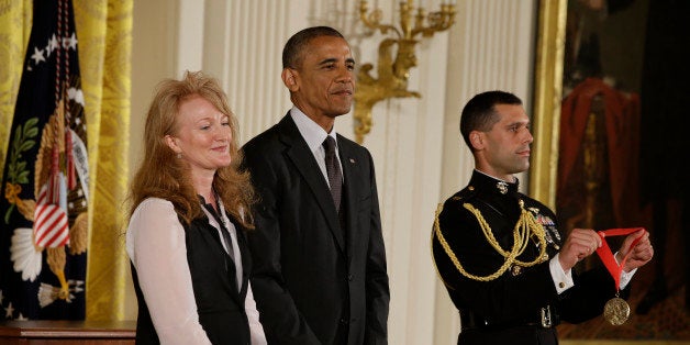 President Barack Obama awards the 2013 National National Humanities Medal to Krista Tippett, radio host, from St. Paul, Minn., during a ceremony in the East Room at the White House in Washington, Monday, July 28, 2014. (AP Photo/Jacquelyn Martin)