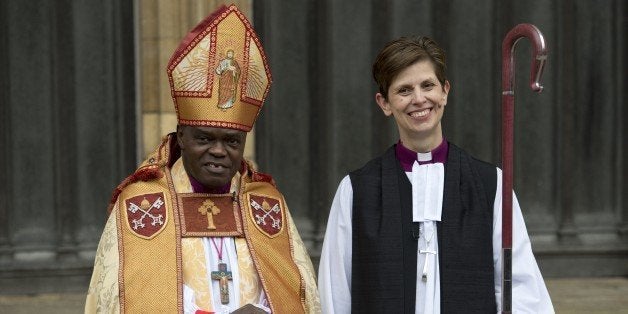 Bishop Libby Lane (R) poses for pictures with Archbishop of York, Dr John Sentamu, as they leave York Minster in northern Eng