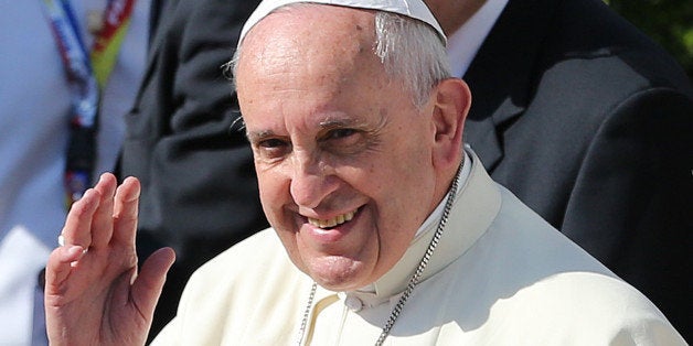 Pope Francis, left, waves to the crowd beside Philippine President Benigno Aquino III before boarding his plane as he departs Manila, Philippines on Monday, Jan. 19, 2015. Pope Francis flew out of this Catholic bastion in Asia on Monday after a weeklong trip that included a visit to Sri Lanka and drew what Filipino officials says was a record crowd of 6 million faithful in a Manila park where he celebrated Mass. (AP Photo/Aaron Favila)