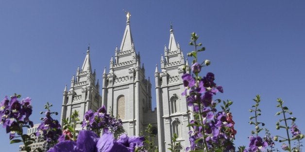 Flowers bloom in front of the Salt Lake Temple in Temple Square in Salt Lake City on Wednesday, Sept. 3, 2014. The Church of Jesus Christ of Latter-day Saints on Wednesday unveiled a new collection that features some of the faith's most treasured artifacts, including a page from the original Book of Mormon manuscript written by founder Joseph Smith. The "Foundations of Faith" exhibit that opens to the public this week in the church's history library in Salt Lake City. (AP Photo/Rick Bowmer)